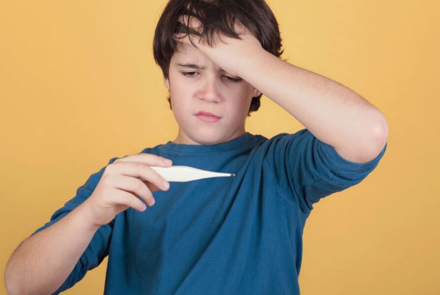 child with thermometer